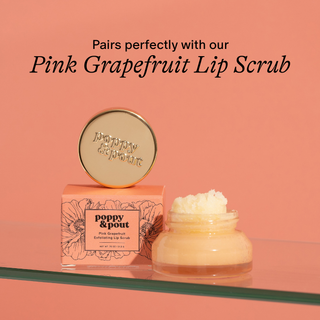 Pink Grapefruit Lip Scrub packaging with a jar of scrub on a peach background