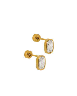 Gold stud earrings with clear gemstones on a white background