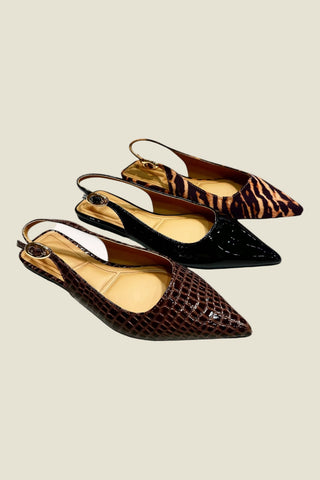 Three pointed slingback flats arranged diagonally on a light beige background. The shoes include a dark brown crocodile-embossed finish, a glossy black finish, and a brown and black tiger-stripe pattern.