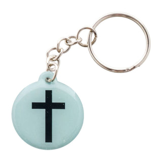 Keychain with a black cross on a light blue circular tag against a white background