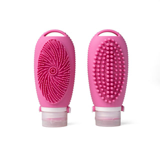 Two pink silicone scrubbers with textured surfaces on a white background