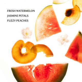 Sliced watermelon and peaches with flowers on a white background