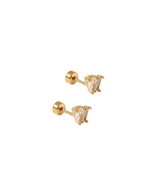 Pair of gold stud earrings with clear gemstones on a white background