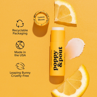 Poppy & Pout lip balm with lemon slices on a yellow background