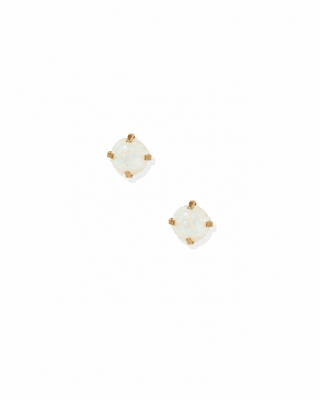 Pair of gold stud earrings with clear gemstones on a white background