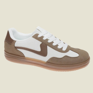 Brown and white sneaker on a white background