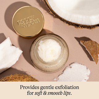 Cosmetic product with gold lid labeled 'Poppy & Poppy' on a beige background with coconut and leaves.