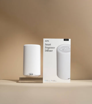 White smarte fragrance diffuser with packaging on a beige background