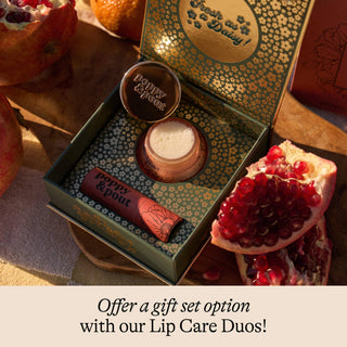 Lip care product set with pomegranate in the background