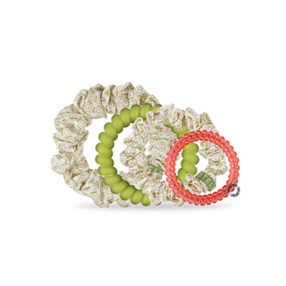 Set of colorful hair ties and scrunchies on a white background