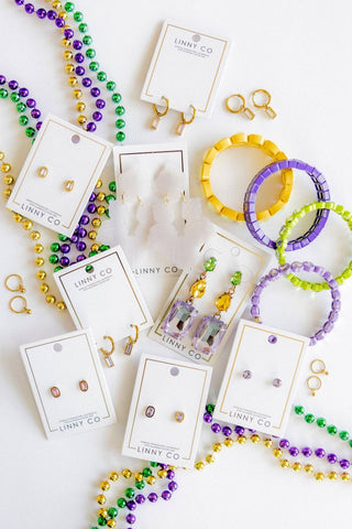Jewelry set including beaded necklaces, bracelets, and earrings on LINNY CO cards.