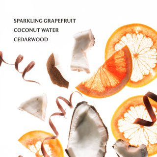 Grapefruit slices, coconut pieces, and ribbons on a white background with text 'Sparkling Grapefruit Coconut Water Cedarwood'.