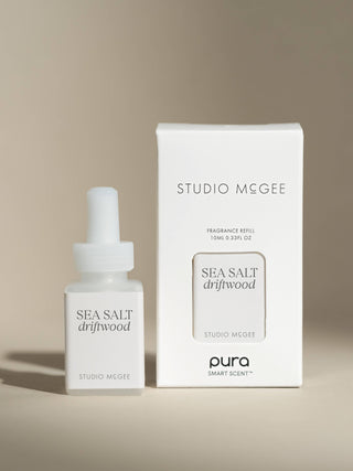 Studio Megee Sea Salt Driftwood fragrance refill bottle and packaging on a beige background