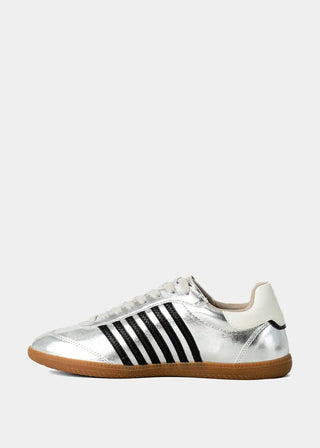 Silver sneaker with black stripes on a white background
