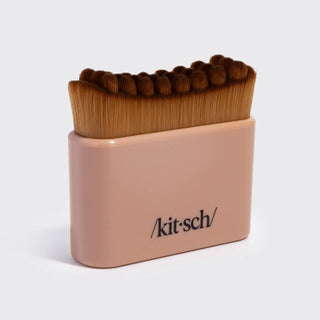 A Kit-Sch makeup brush set in a dusty pink rectangular holder, featuring brown bristles and the Kit-Sch logo printed in black on the front, shot against a light gray background.