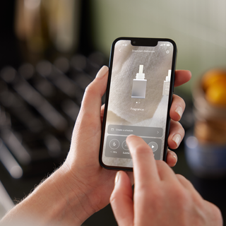 Person using a smartphone app on a blurred background