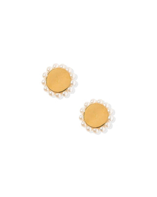 Pair of gold earrings with pearl-like centers on a white background