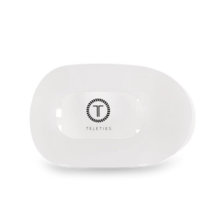 White silicone hair clip on a white background with 'Teleties' branding on a white background