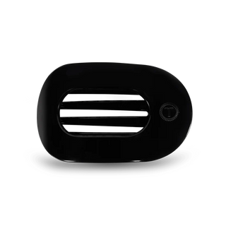 Black flat hair clip with teleties logo on a white background