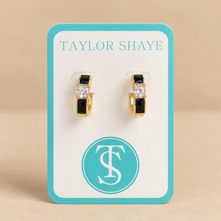 Black and gold hoops on a Taylor shaye card on a tan background 