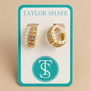 Pearl and rhinestone hoops on a Taylor shaye card on tan background