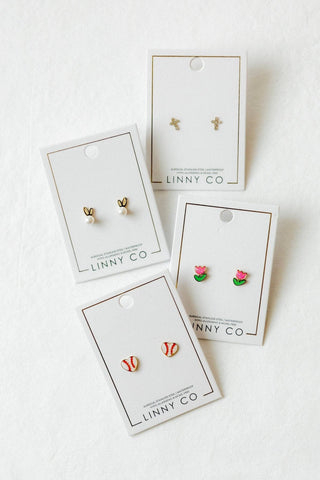 Set of earrings on LINNY CO branded cards against a white background