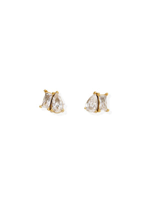 Pair of gold earrings with clear gemstones on a white background