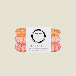 Set of colorful hair ties with a Teleties label on a white background