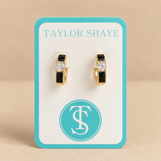 Black and gold hoops on a Taylor shaye card on a tan background 