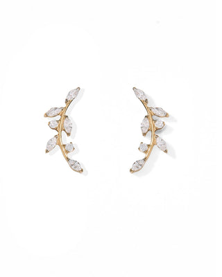 A pair of gold crescent-shaped stud earrings decorated with marquise-cut clear crystals, displayed on a clean white background.