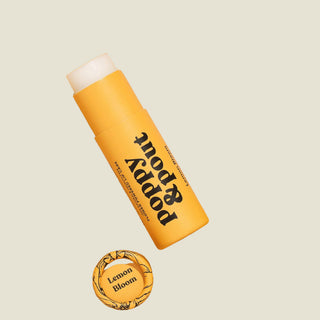 Yellow tube of 'mod & kudd' soap with a white bar of soap on an orange background