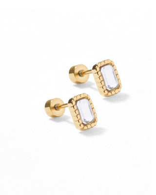 Gold earrings with clear gemstones on a white background