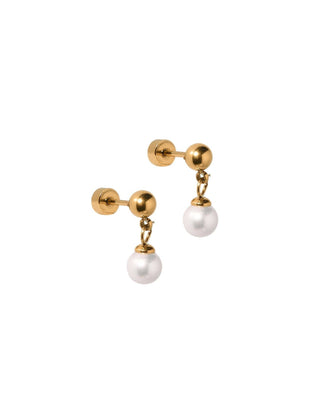A pair of gold post earrings with a small gold ball, a short chain, and a dangling white pearl on a plain white background.