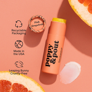 Lip balm with 'Poppy & Pout' branding on a pink background with grapefruit slices.