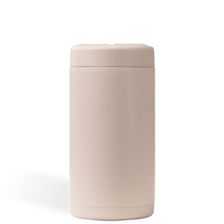 Beige cylindrical container with lid on a white background