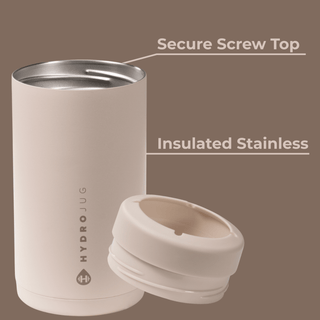 Beige tumbler with secure screw top on a brown background
