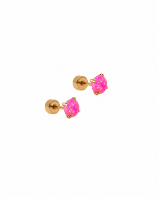Pair of gold stud earrings with pink gemstones on a white background
