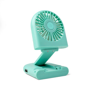 Turquoise portable fan on a white background