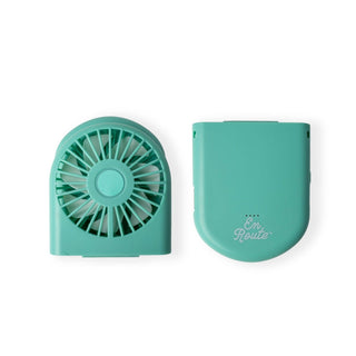 Teal portable fan with cover on a white background