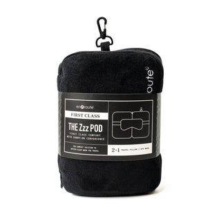 Black travel pillow with label on a white background