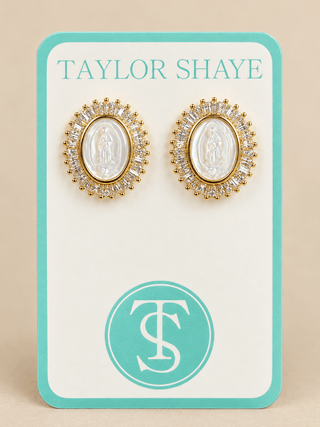 Taylor Shaye Grace Pearl Halo Earrings, gold-tone oval studs with a mother-of-pearl Mother Mary center and baguette crystal halo