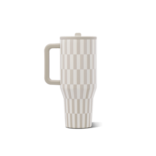 A travel tumbler with a handle and lid, featuring a beige and off-white geometric checkerboard pattern, shown on a solid white background.