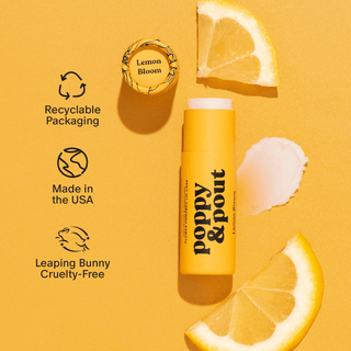 Poppy & Pout lip balm with lemon slices on a yellow background