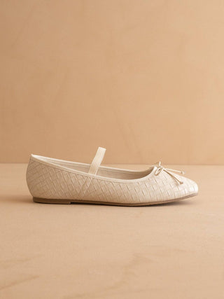 Beige ballet flat shoe on a beige background