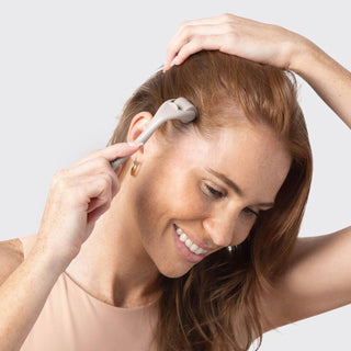 Model using the Kitsch Micro Derma Facial Roller