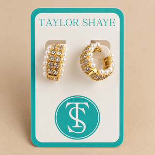 Pearl and rhinestone hoops on a Taylor shaye card on tan background