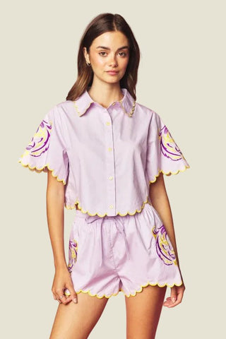 Model wearing purple short set with Tiger embroidery 