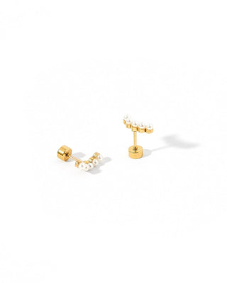Gold earrings with pearls on a white background
