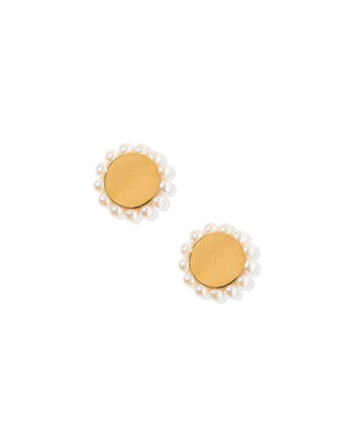 Pair of gold earrings with pearl-like centers on a white background