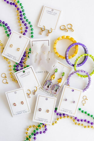 Jewelry set including beaded necklaces, bracelets, and earrings on LINNY CO cards.